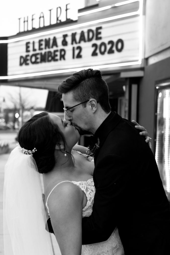 Planning a Winter Wedding in Kansas City, Mission Theater, December wedding, black suit, lace wedding dress, kansas city photographer, marquee letters, marquee wedding sign, theater venue, winter wedding bouquet inspo, winter wedding aesthetic, bridal hair piece,