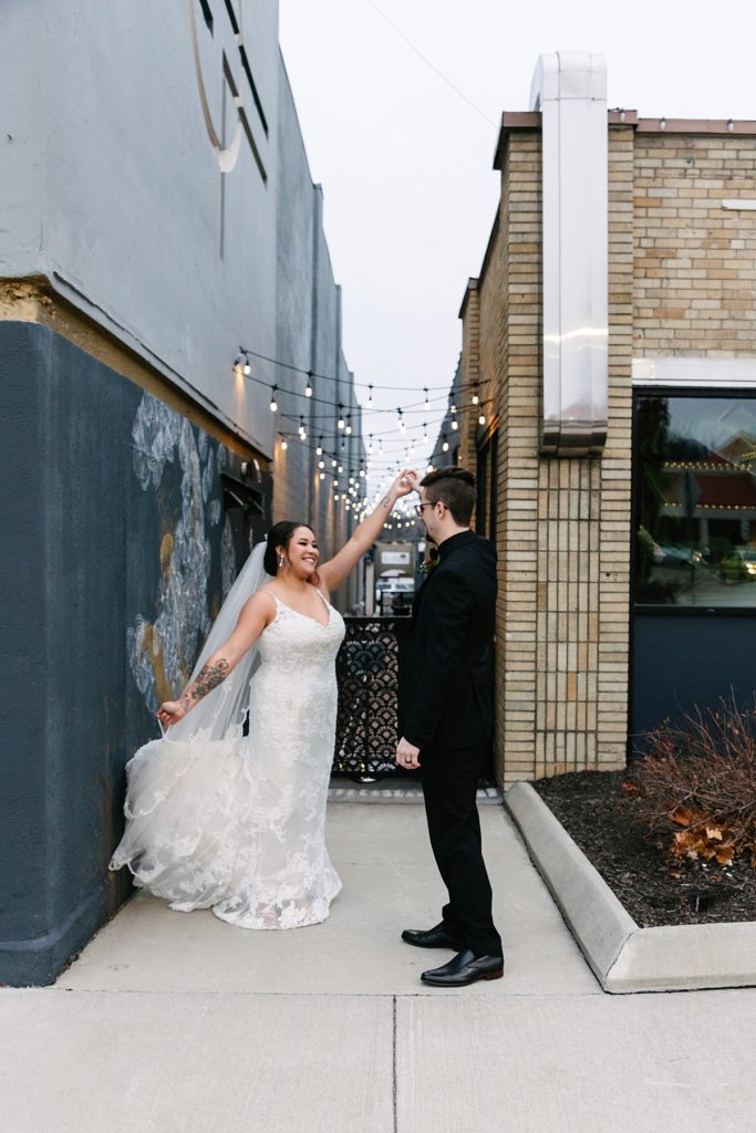 Planning a Winter Wedding in Kansas City, Mission Theater, December wedding, black suit, lace wedding dress, kansas city photographer, marquee letters, marquee wedding sign, theater venue, winter wedding bouquet inspo, winter wedding aesthetic, bridal hair piece,
