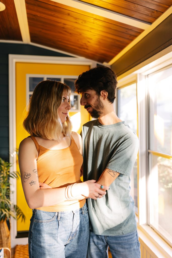Five Tips For Your In-Home Photoshoot, Kansas City photographer, engagement session, engagement session locations, thrifted home decor, boho home, little blue house, fall engagement session, unique engagement session, intimate engagement session, true love, candid photos, looks like film, sunroom, golden hour, front porch