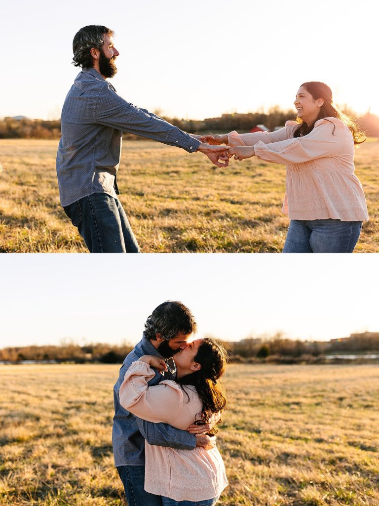 Engaged couple dancing in the middle of a field on the farm land they own. 