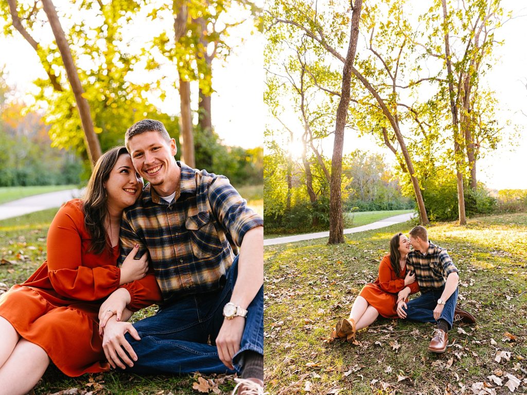 Engaged couple sitting in a park for their photo shoot with Kansas City Photographer, Natalie Nichole.