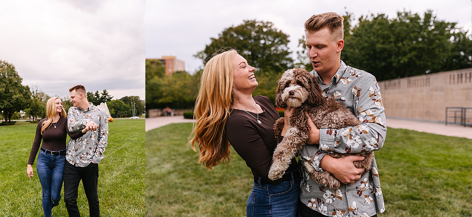 Puppy in the arms of newly engaged couple in front of museum in Kansas City. 