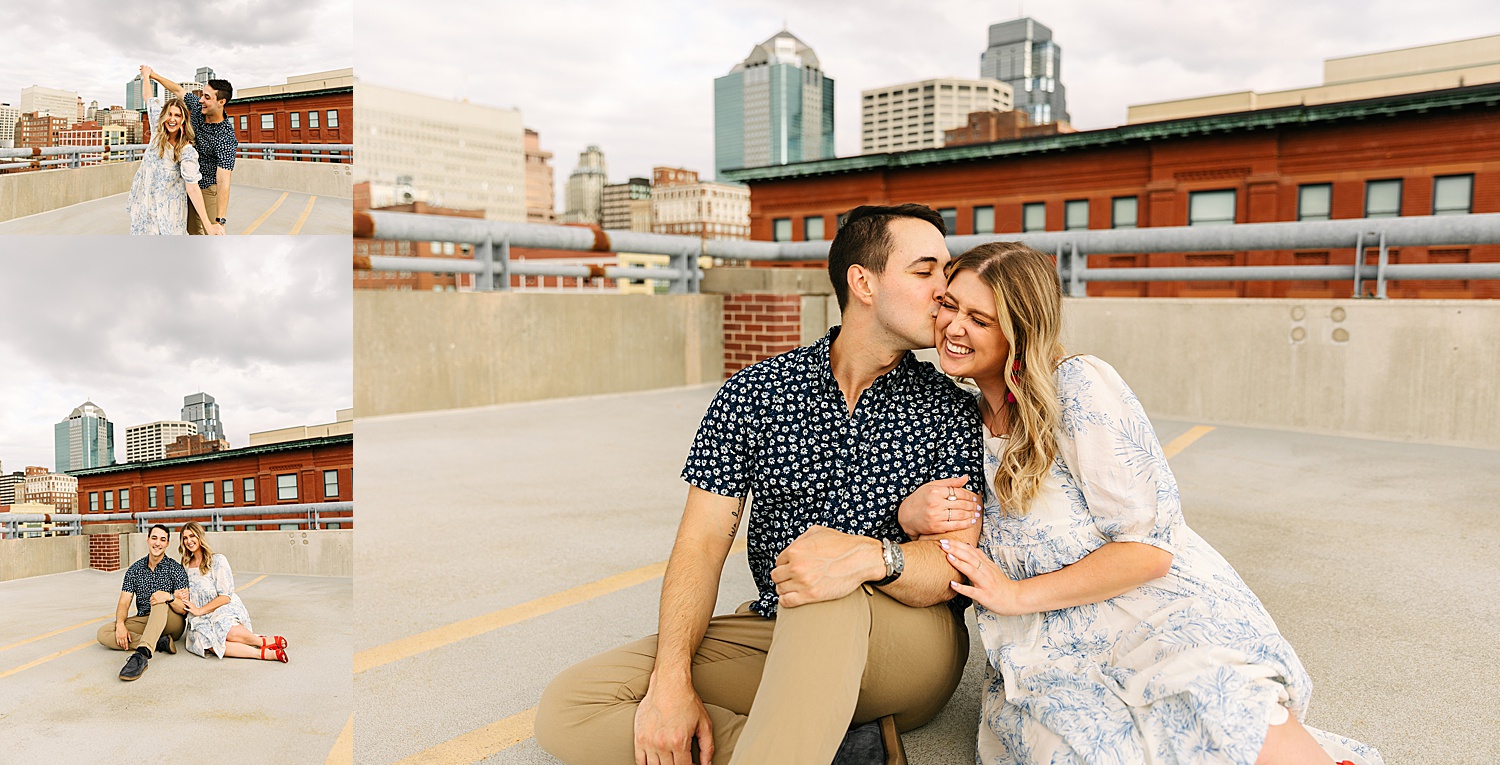 couple being playful on rooftop with Kansas City photographer wearing engagement ring