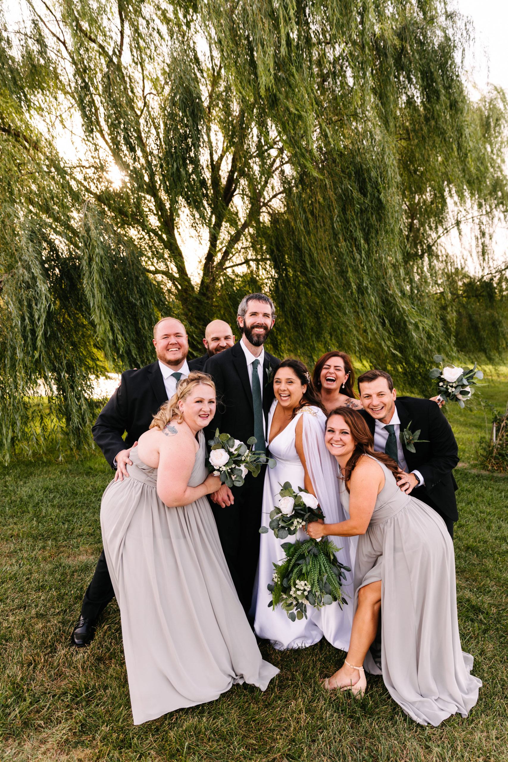 fun ways to get photos of wedding guests, wedding party takes photos during a fall outdoor wedding in Kansas City