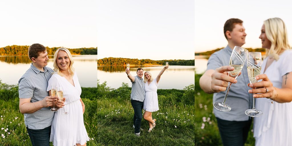 Newly engaged couple clink glasses during engagement session after popping bottle of champagne