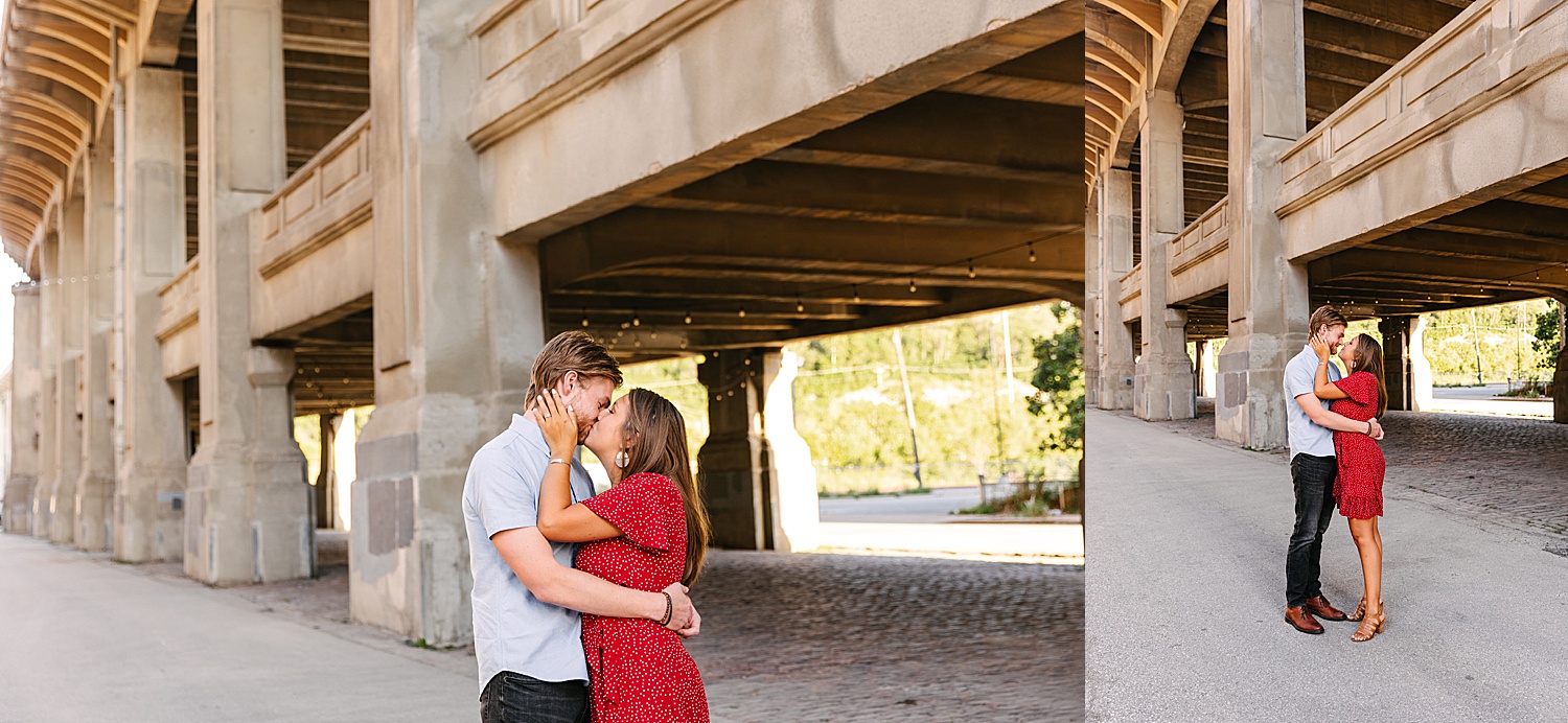 Engaged man and woman wearing red dress kissing at Westbottoms summer engagement session